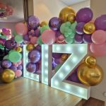 LIZ - Large Light Up letters complemented with balloons