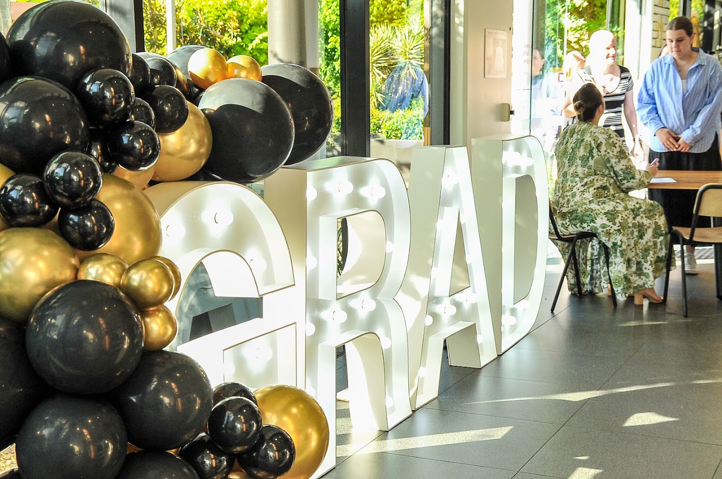 Amongst the Graduates are the letters that spell out the positive mood: GRAD