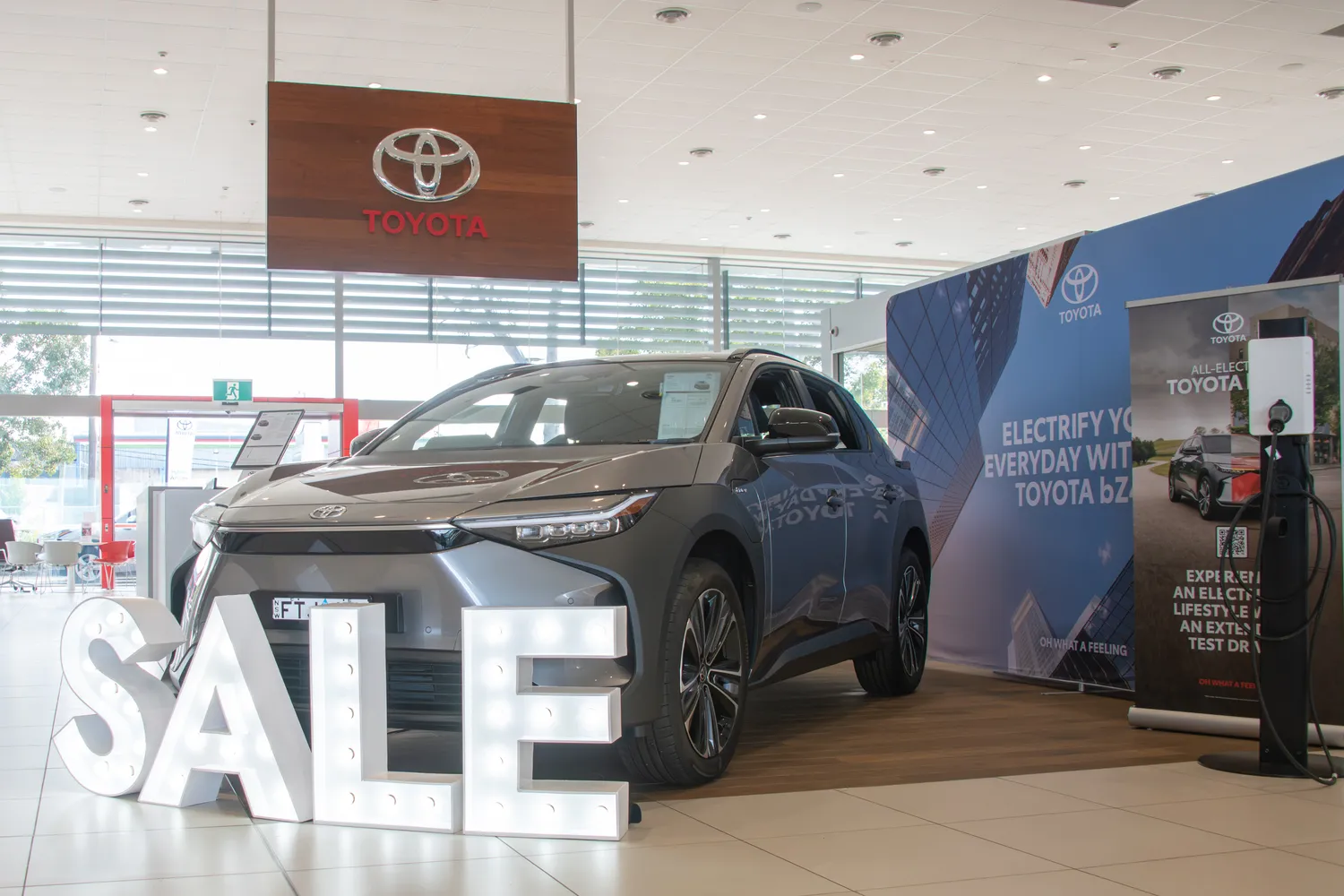 SALE stickers draw attention to key showroom cars, especially when it's too busy for a customer service rep to help make that first impression.