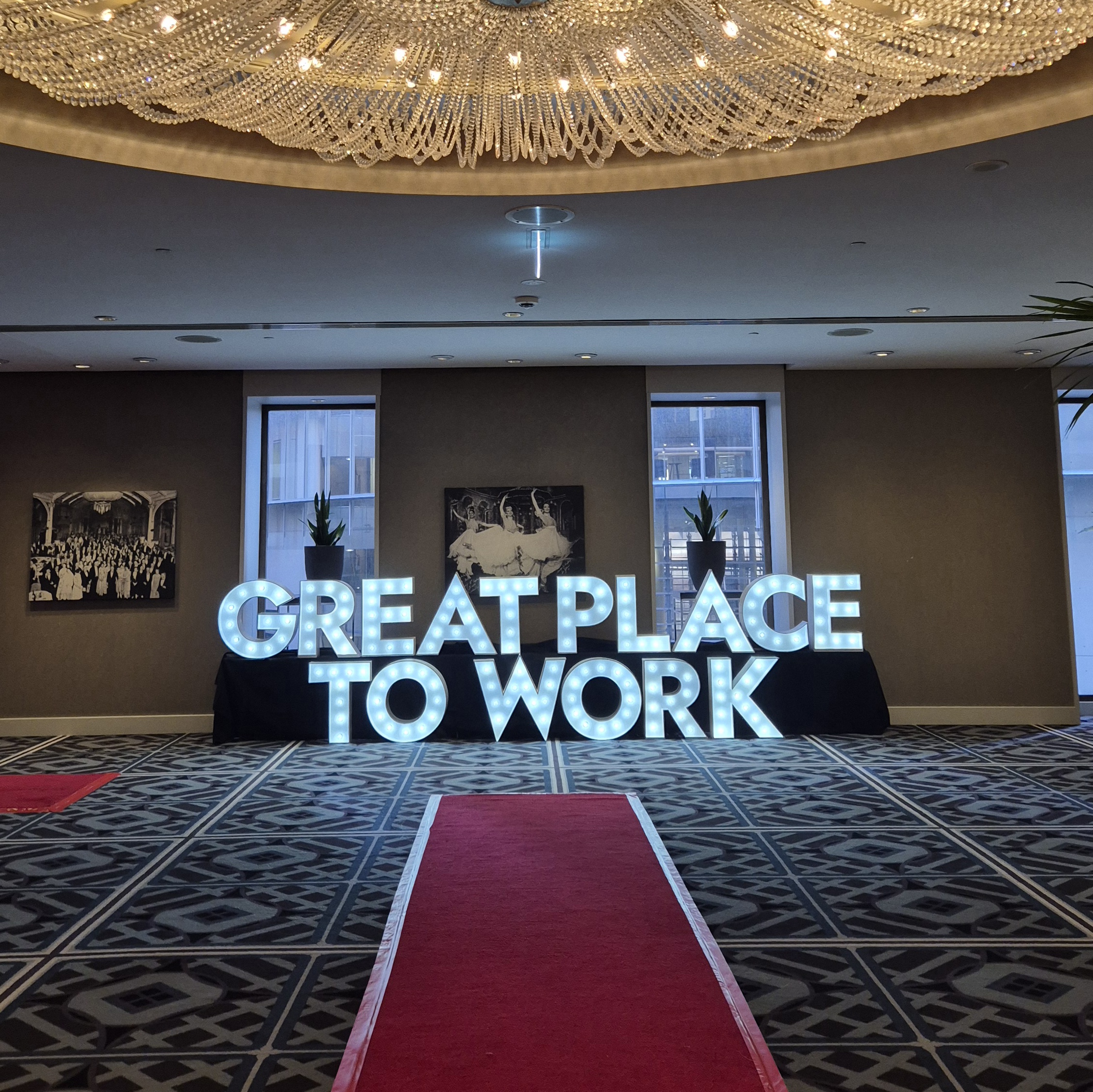Corporate Events lit up with giant light up letters spelling GREAT PLACE TO WORK